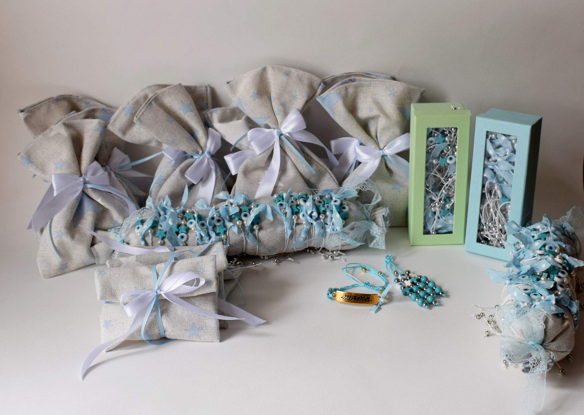 Χειροποίητες μπομπονιέρες βάπτισης πουγκιά με αστέρι και μαρτυρικά